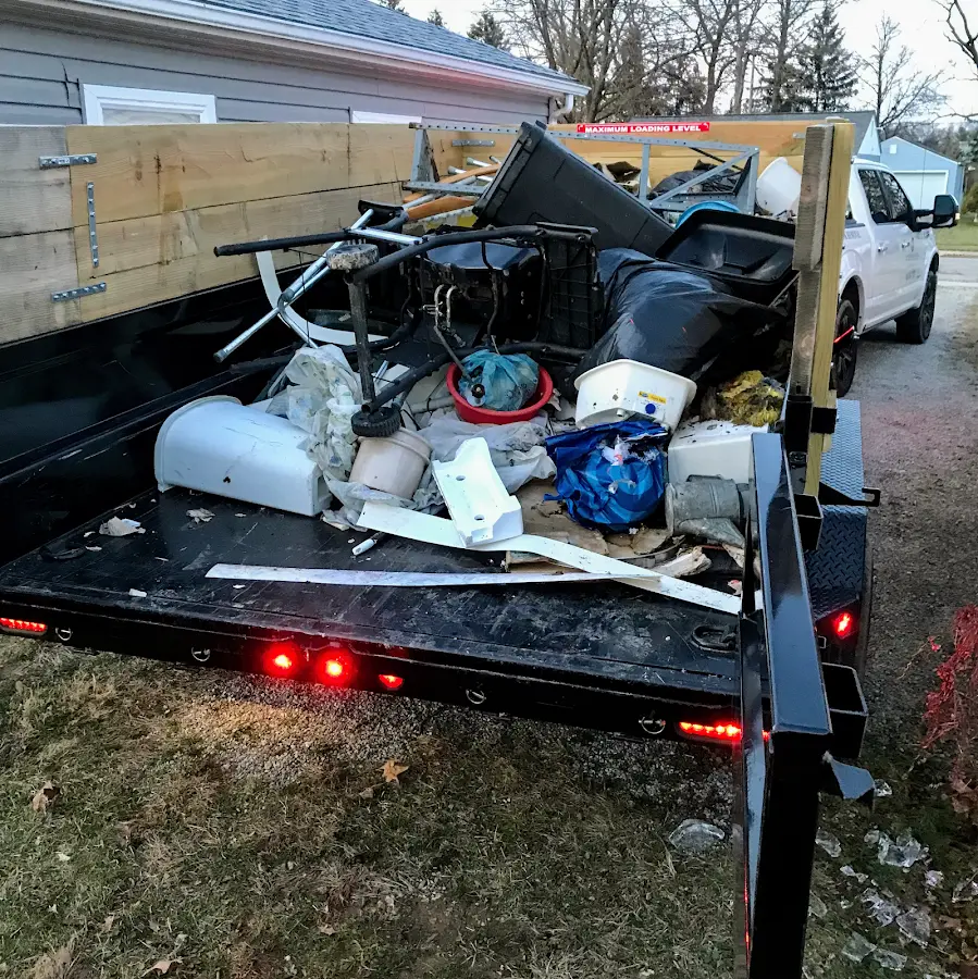 Roll-off dumpster delivered to a residential driveway in Harbor Bluffs