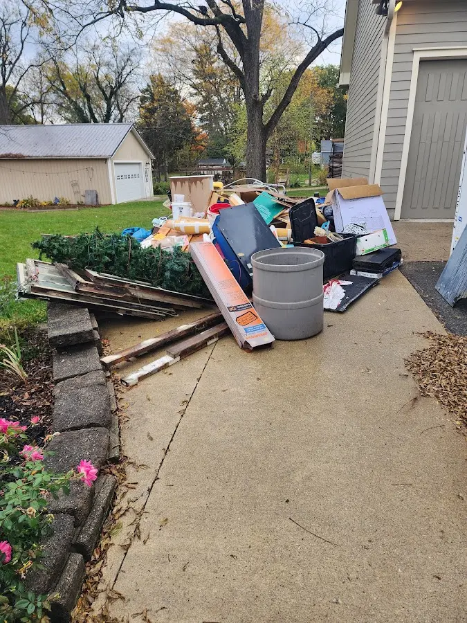 Dumpster being loaded with debris for 30 Yard Dumpster Rental in Harbor Bluffs